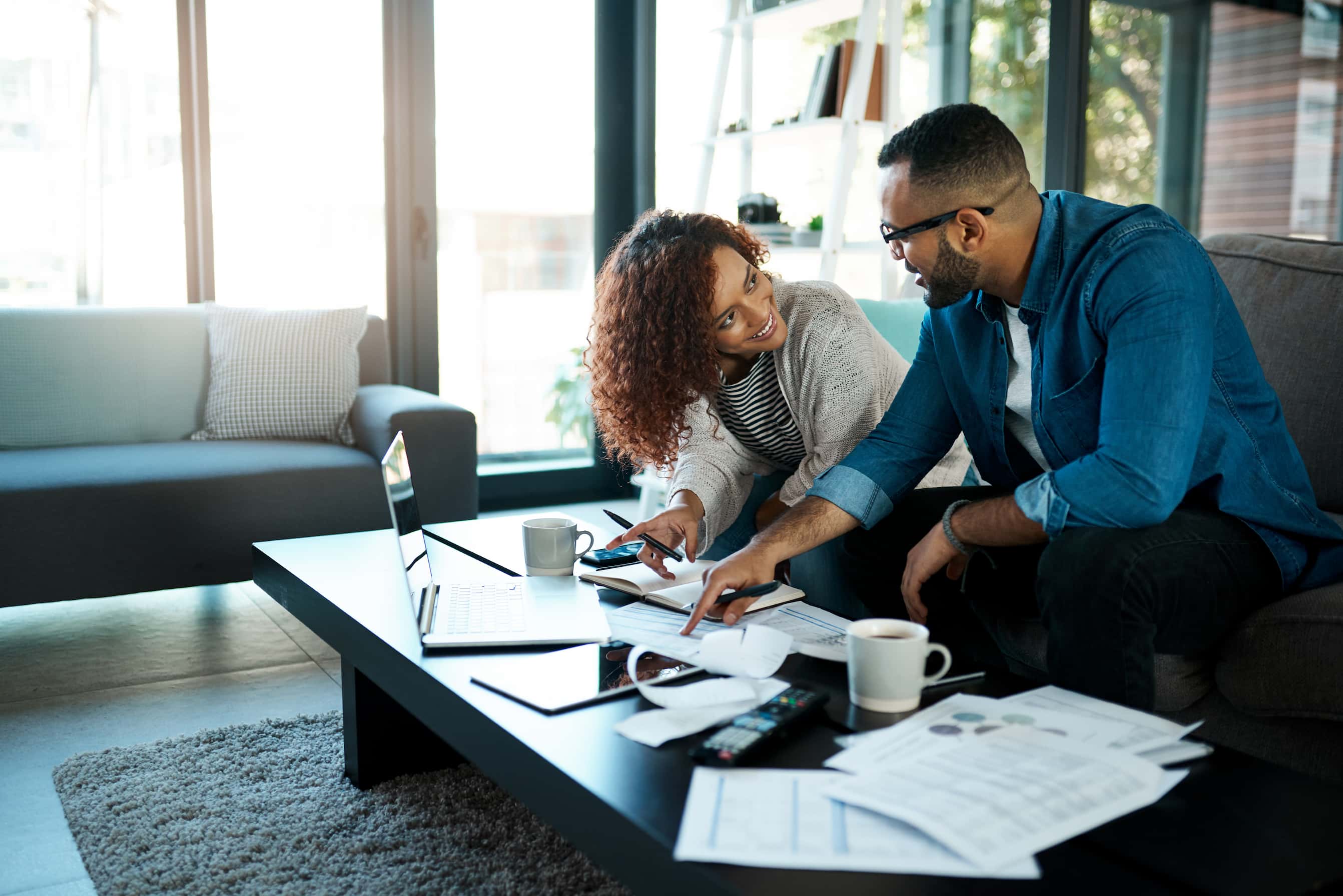 A couple looking over their savings plans