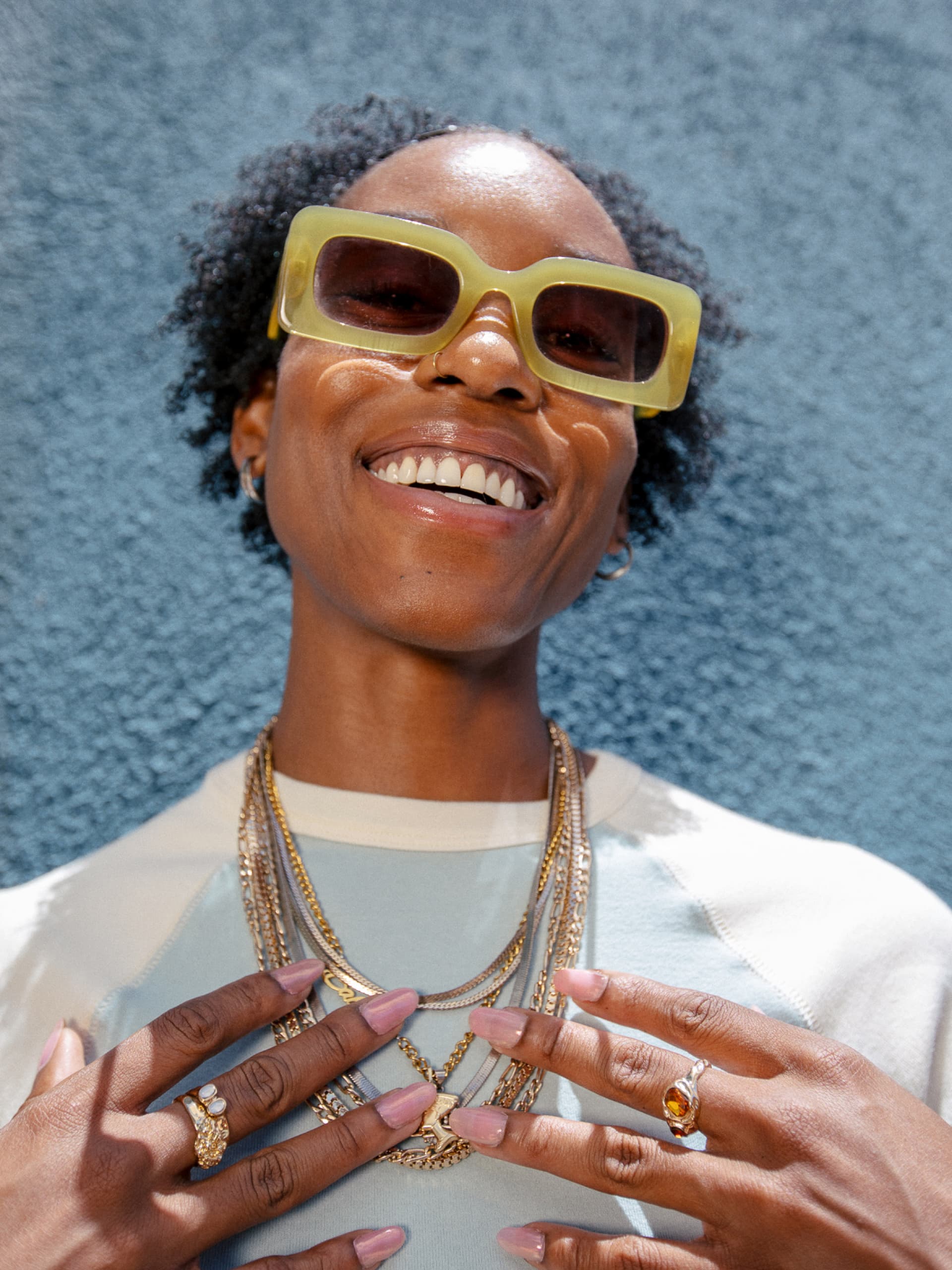 Person wearing sunglasses and smiling