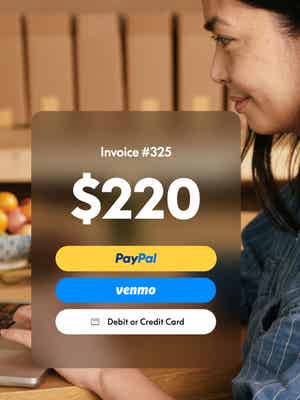 Woman working on laptop with invoice overlay showing $220 due and options to pay with PayPal, Venmo, or credit or debit card